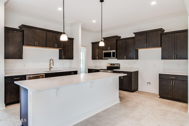 kitchen featuring sink, stainless steel appliances, pendant lighting, and dark brown cabinetry