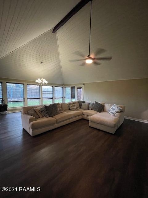 living room featuring ceiling fan with notable chandelier, high vaulted ceiling, a wealth of natural light, and dark wood-type flooring