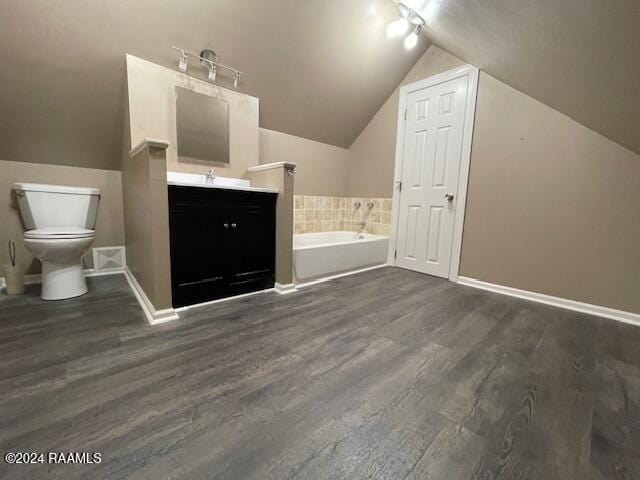 bathroom with a bath, wood-type flooring, track lighting, and lofted ceiling