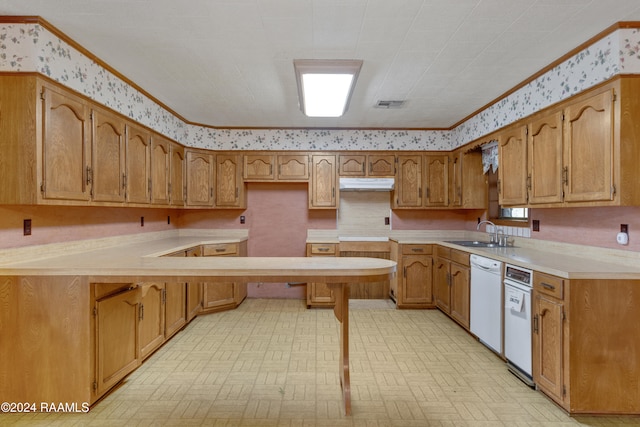 kitchen featuring dishwasher, ornamental molding, and sink