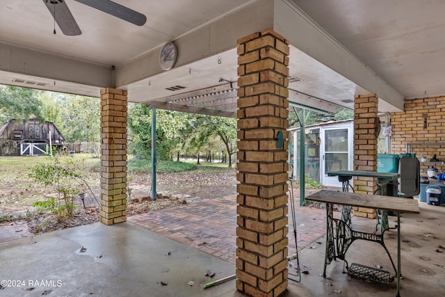 view of patio featuring ceiling fan