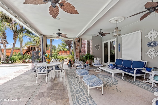 view of patio / terrace with ceiling fan and an outdoor hangout area