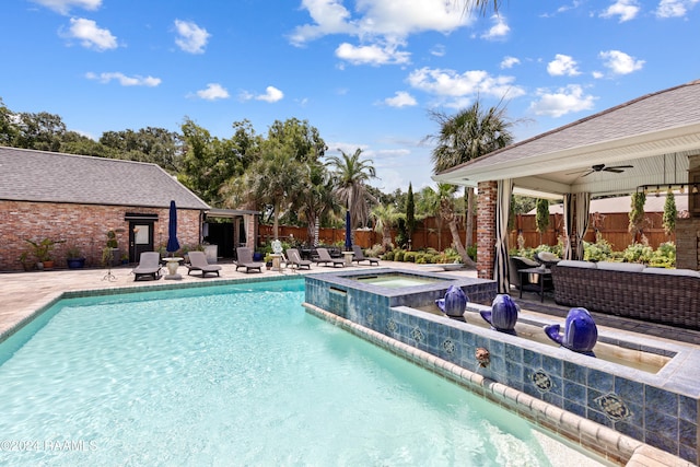 view of pool featuring an outdoor living space, a patio, an in ground hot tub, and ceiling fan