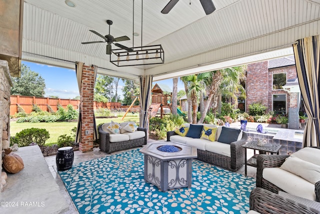 sunroom / solarium with ceiling fan