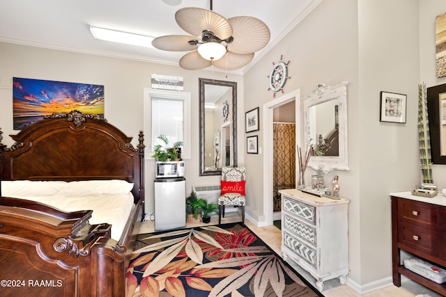 bedroom featuring ensuite bath, ceiling fan, and crown molding