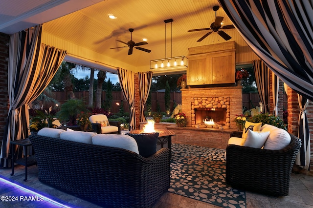 view of patio featuring an outdoor living space with a fireplace and ceiling fan