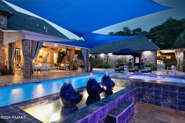 view of swimming pool with a patio and an outdoor bar