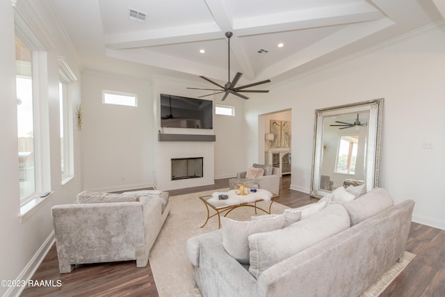 living room featuring ceiling fan, plenty of natural light, dark hardwood / wood-style flooring, and crown molding