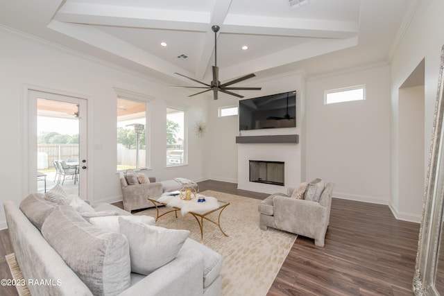 living room with ceiling fan, plenty of natural light, dark hardwood / wood-style flooring, and crown molding