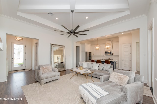 living room with beamed ceiling, ornamental molding, ceiling fan, coffered ceiling, and dark wood-type flooring