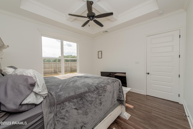 bedroom with ceiling fan, crown molding, and dark hardwood / wood-style flooring