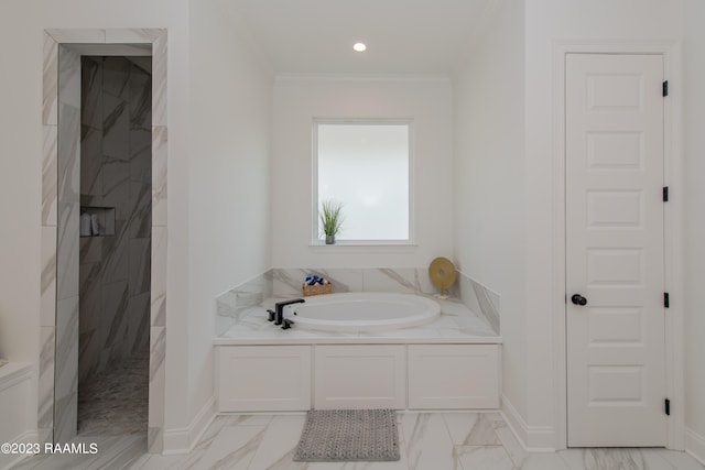 bathroom featuring independent shower and bath and ornamental molding