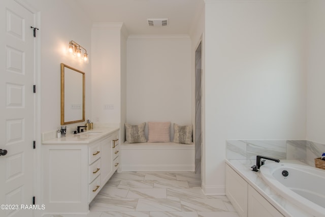 bathroom featuring a bathing tub, vanity, and crown molding