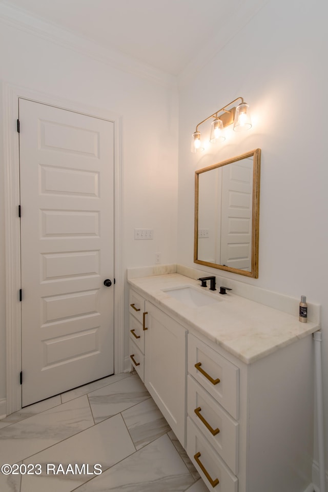 bathroom featuring vanity and ornamental molding