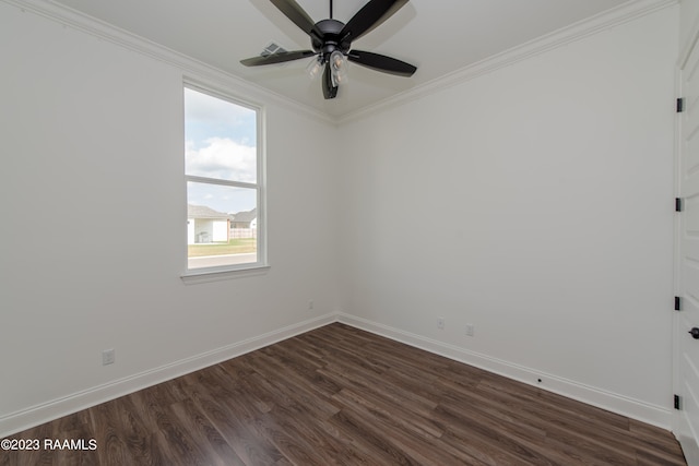 spare room featuring dark hardwood / wood-style flooring, ceiling fan, and crown molding