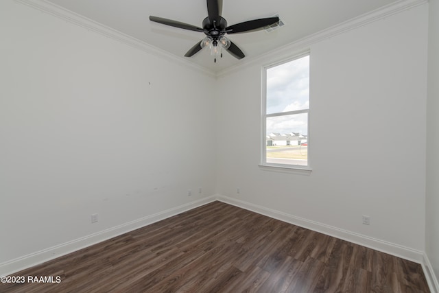 empty room featuring ornamental molding, dark wood-type flooring, and ceiling fan