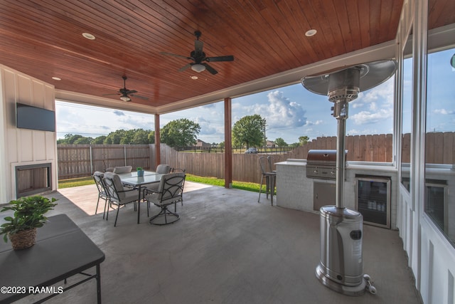 view of patio featuring area for grilling and ceiling fan