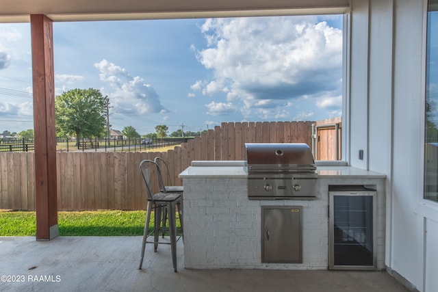 view of patio featuring area for grilling and exterior kitchen