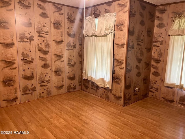 empty room featuring hardwood / wood-style floors and a healthy amount of sunlight