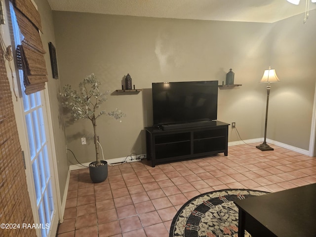 1318 Dulles Dr Unit B, Lafayette, LA 70506 - living room with light tile patterned floors and baseboards