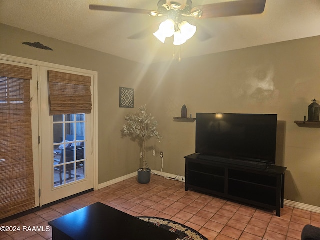 interior space with light tile patterned floors and ceiling fan