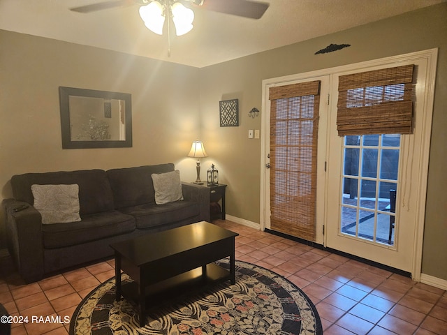 tiled living room with ceiling fan