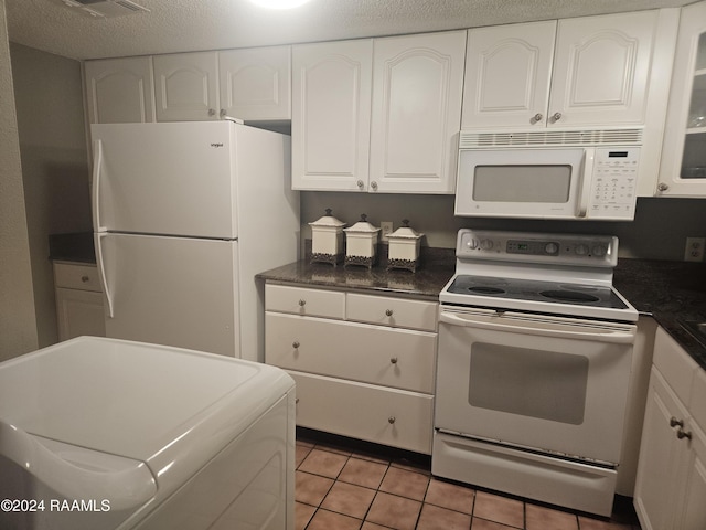 1318 Dulles Dr Unit B, Lafayette, LA 70506 - kitchen with white appliances, washer / dryer, white cabinets, and dark countertops
