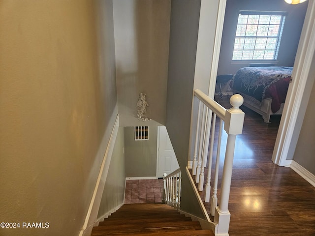 stairs with wood-type flooring