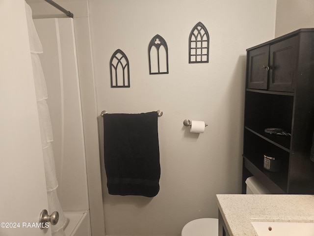 full bathroom featuring toilet, washtub / shower combination, and vanity