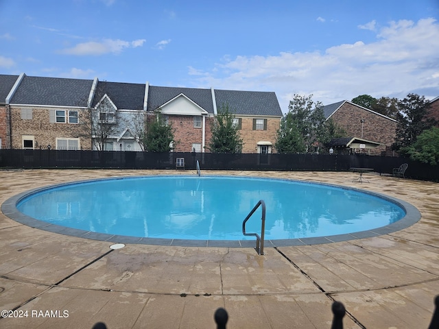 1318 Dulles Dr Unit B, Lafayette, LA 70506 - view of swimming pool with a patio area