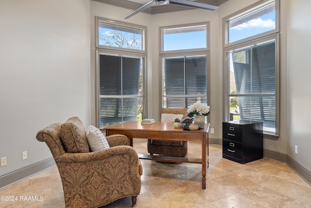 office with ceiling fan, a towering ceiling, and a healthy amount of sunlight