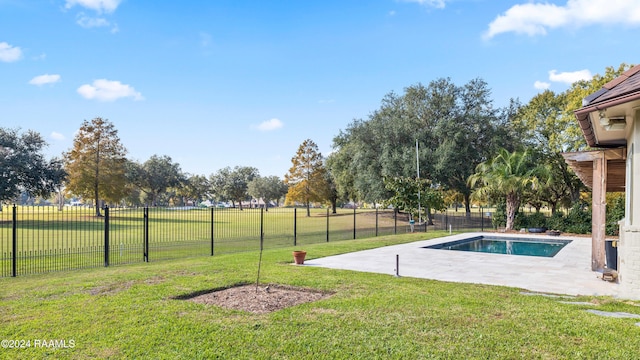 view of pool featuring a yard and a patio area