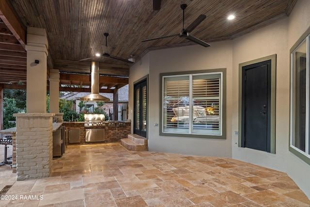 view of patio / terrace featuring exterior kitchen, area for grilling, and ceiling fan