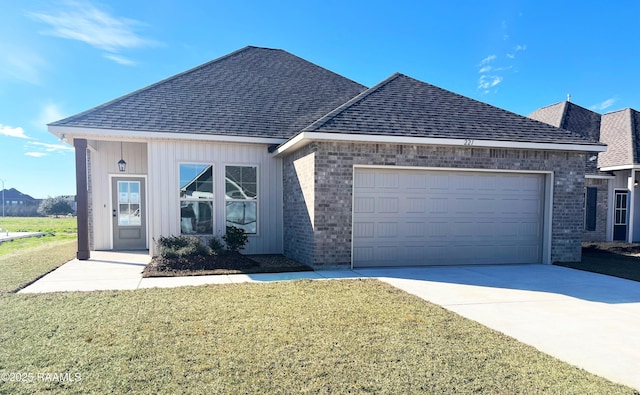 view of front of home with a garage and a front yard