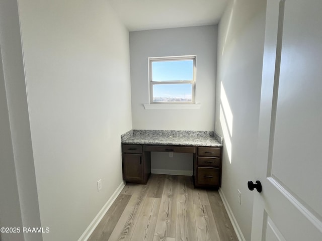 interior space featuring light hardwood / wood-style floors and built in desk