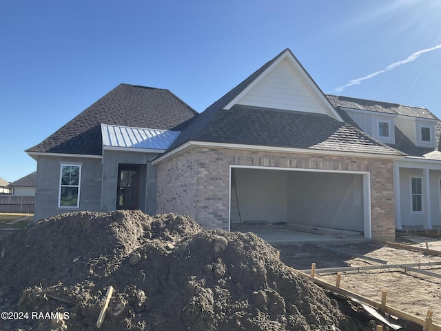 view of front of property featuring a garage