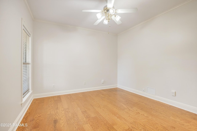 unfurnished room with crown molding, ceiling fan, and light wood-type flooring