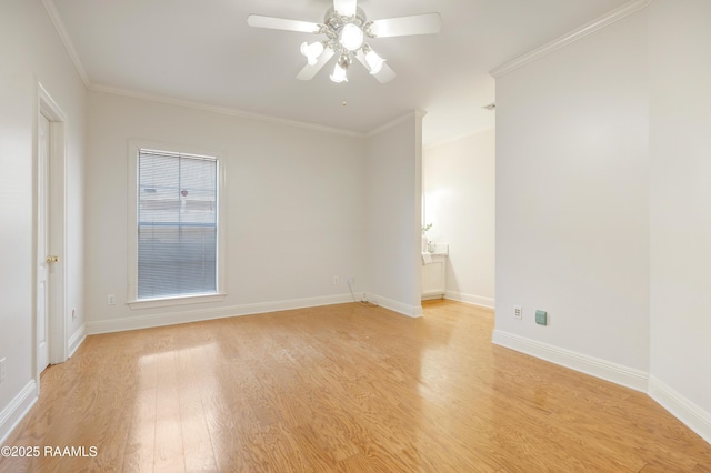 empty room featuring ornamental molding, ceiling fan, and light hardwood / wood-style flooring