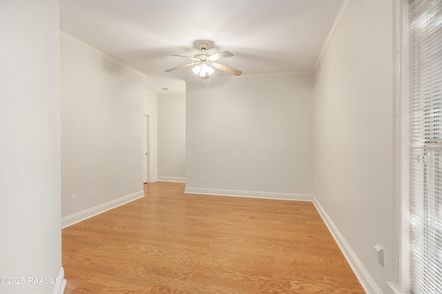 empty room featuring crown molding, ceiling fan, and light wood-type flooring