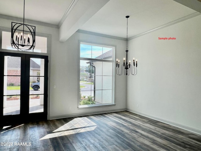 entryway featuring dark wood-type flooring, french doors, crown molding, baseboards, and a chandelier