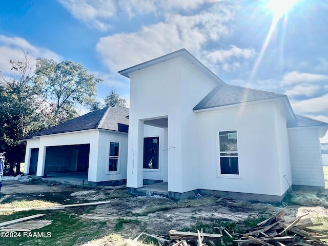 view of side of property with a garage