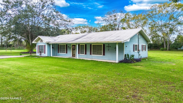 ranch-style house with covered porch and a front lawn