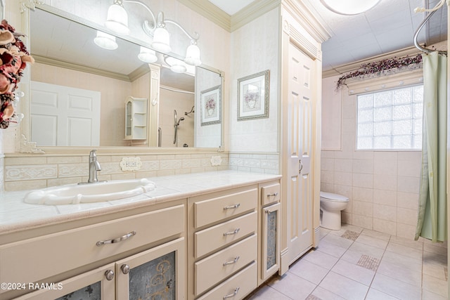 bathroom featuring tile patterned floors, vanity, crown molding, tile walls, and toilet