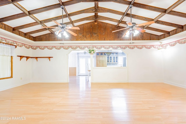 spare room featuring light wood-type flooring, ceiling fan, and a healthy amount of sunlight