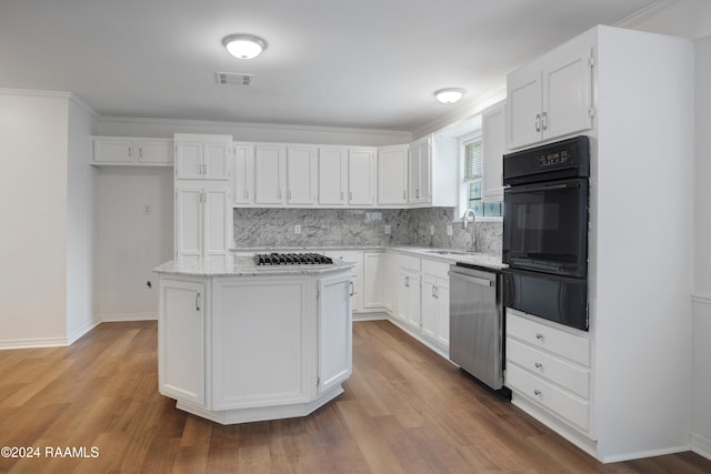 kitchen featuring white cabinetry, appliances with stainless steel finishes, sink, and light wood-type flooring