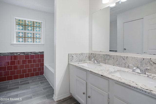 bathroom featuring tile walls, vanity, and hardwood / wood-style floors