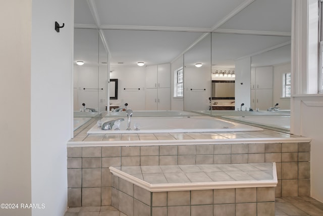 bathroom featuring vanity, a wealth of natural light, and tile patterned floors