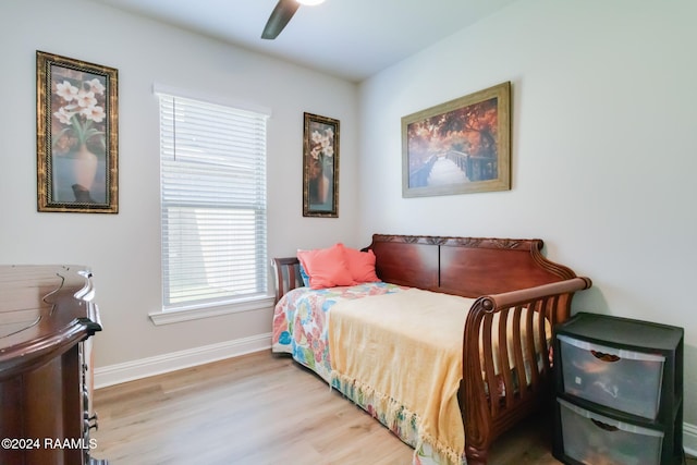 bedroom with light wood-type flooring and ceiling fan