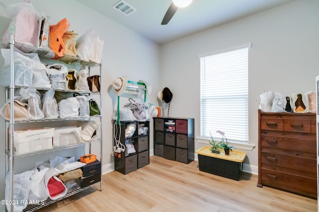 misc room with light wood-type flooring and ceiling fan