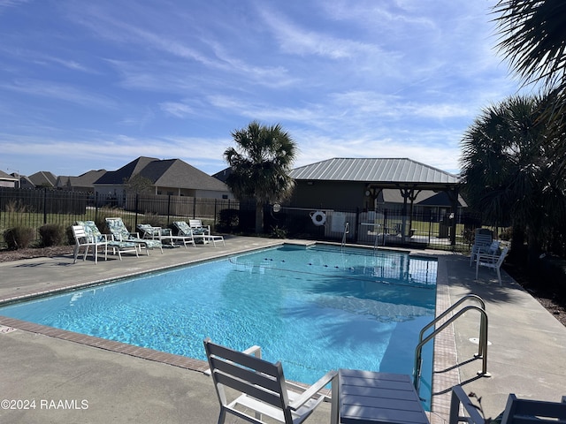 view of swimming pool with a gazebo and a patio